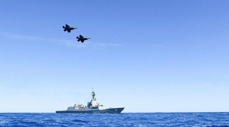 A pair of Air Force F35-A Lightning aircraft conduct a flypast over HMAS Hobart during Exercise Tasman Shield. Photo by Petty Office BT Matchett.