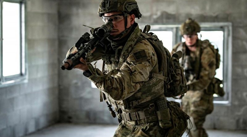 Private Keegan Newbery, front, from the 8th/9th Battalion, Royal Australian Regiment, conducts a room clearance during urban warfare tactical assault training at Gallipoli Barracks. Photo by Private Jacob Hilton.