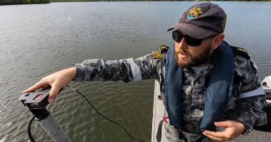 Able Seaman Hydrographic Systems Operator Andrew Hespe prepares to do a hydrographic survey in Chinaman Creek, Cairns. Photo by Leading Seaman Shane Cameron.