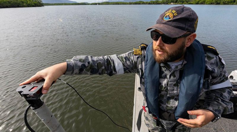 Able Seaman Hydrographic Systems Operator Andrew Hespe prepares to do a hydrographic survey in Chinaman Creek, Cairns. Photo by Leading Seaman Shane Cameron.