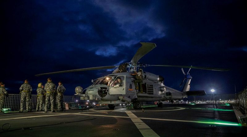 The MH-60R helicopter with the call sign Berserker being prepared for launch from HMAS Anzac. Photo by Leading Seaman Thomas Sawtell.