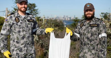 Sub-Lieutenants Nicholas Croke, left, and William Anderson from HMAS Watson participate in the Clean-Up Australia Day event in Sydney. Photo by Able Seaman Benjamin Ricketts.
