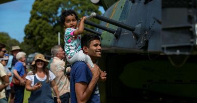 Local residents take a tour of Navy MRH-90 Taipan during HMAS Choules visit to ceremonial homeport of Mallacoota. Photo by Leading Seaman Leo Baumgartner.