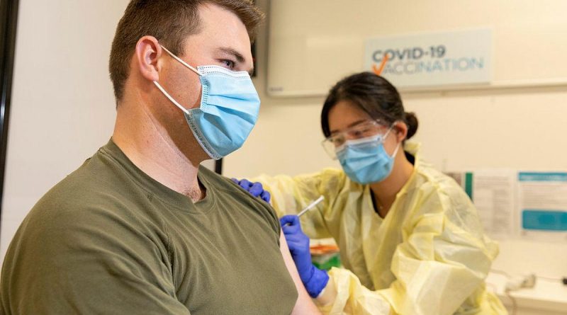 Trooper Jack Calcino receives a COVID-19 vaccine from registered nurse Daisy Hwang at the Royal Adelaide Hospital. Photo by Leading Aircraftman Stewart Gould.