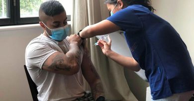 ADF medic Private Christie Rayner, from the Joint Health Unit - North Queensland, administers the COVID-19 vaccine to Lorna Pollack at the Blue Care aged-care facility in Ingham, Queensland.