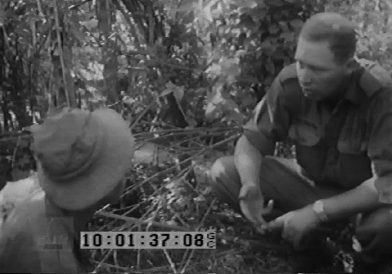 Captain Sandy MacGregor briefs a 'tunnel rat' on Operation Enoggera.