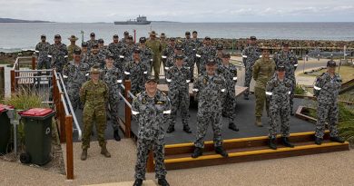 HMAS Choules Commanding Officer Commander Ben Reilly, members of his crew and their ship at Mallacoota to announce that the Victorian town was the ship's new ceremonial homeport. Photo by Leading Seaman Leo Baumgartner.