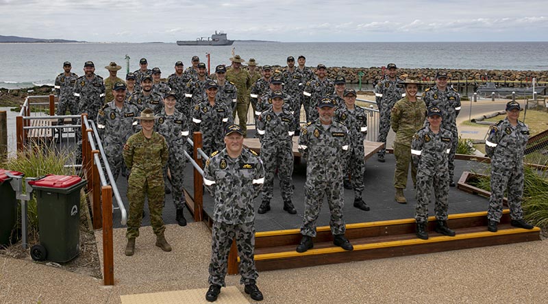 HMAS Choules Commanding Officer Commander Ben Reilly, members of his crew and their ship at Mallacoota to announce that the Victorian town was the ship's new ceremonial homeport. Photo by Leading Seaman Leo Baumgartner.
