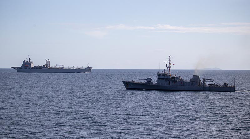 HMAS Sirius sails past Philippine Navy ship BRP Emilio Jacinto during a passage exercise in the Sulu Sea. Photo by Leading Seaman Thomas Sawtell.