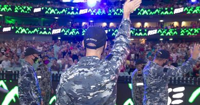 Australian Defence Force members wave to the crowd at the Sydney Gay and Lesbian Mardi Gras Parade 2021 at the Sydney Cricket Ground. Photo by Leading Seaman Nadav Harel.