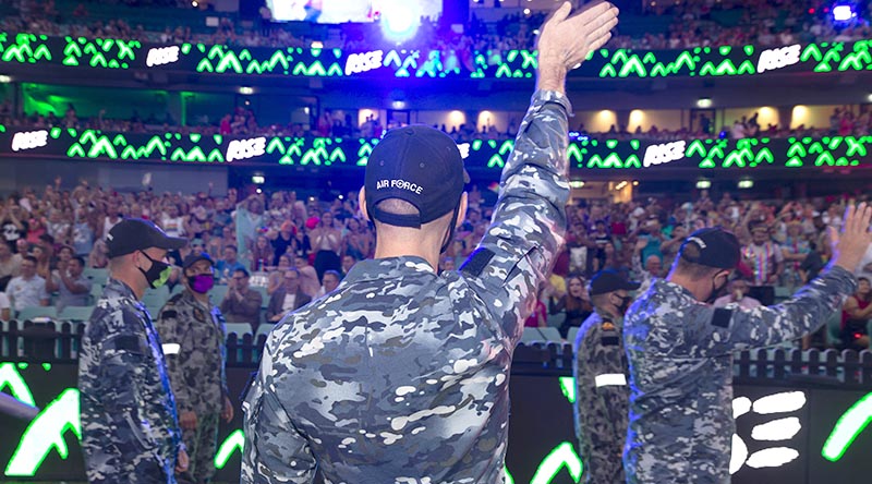 Australian Defence Force members wave to the crowd at the Sydney Gay and Lesbian Mardi Gras Parade 2021 at the Sydney Cricket Ground. Photo by Leading Seaman Nadav Harel.