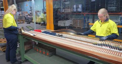 Thales Australia employees conduct final visual inspection on .50 calibre link ammunition at Benalla, Victoria. Thales photo.