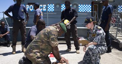 Royal Australian Navy Lieutenant Rhianna Jones teaches CPR to police officers from the Vanuatu Police Force Maritime Wing and Vanuatu Mobile Ground Forces soldiers in Port Villa, Vanuatu. Photo by Sergeant Ray Vance.