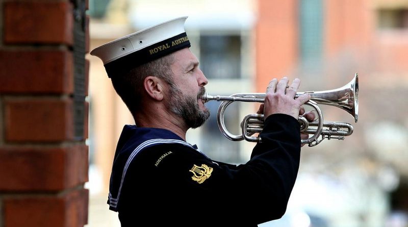 Leading Seaman Musician Marcus Salone plays the Last Post during a memorial service held on completion of the Freedom of Entry at the Bathurst War Memorial. Story by Sebastian Beurich.