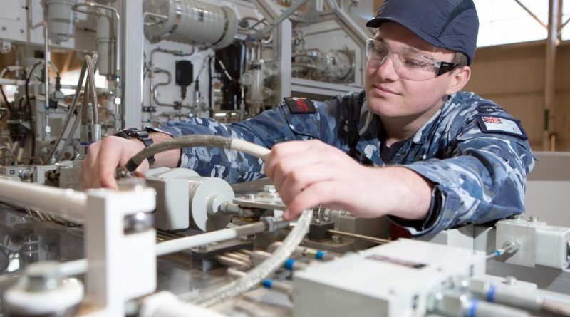 Aircraftman Bailey Gray sporting a bump cap while undertaking maintenance checks on the GENFLY 1 training aid at the RAAF School of Technical Training, RAAF Base Wagga. Story by Flight Lieutenant Julia Ravell. Photo by Corporal Kylie Gibson.