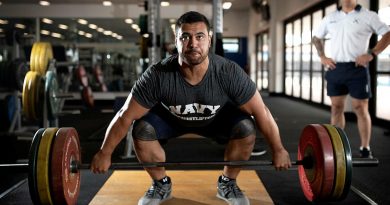 Weightlifter Leading Seaman Suamili Nanai trains at HMAS Stirling in Western Australia under the watchful eye of Leading Seaman Physical Training Instructor Jakob Pekolj. Photo by Petty Officer Yuri Ramsey.