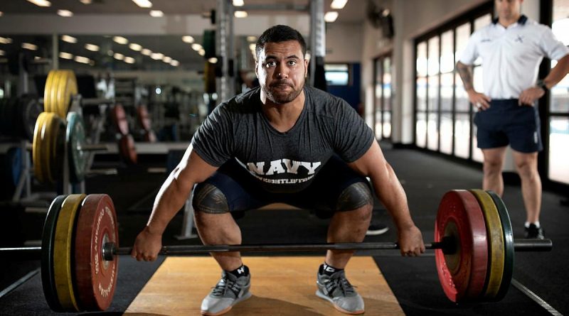 Weightlifter Leading Seaman Suamili Nanai trains at HMAS Stirling in Western Australia under the watchful eye of Leading Seaman Physical Training Instructor Jakob Pekolj. Photo by Petty Officer Yuri Ramsey.