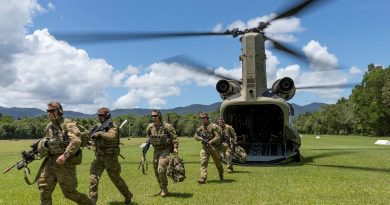 Soldiers from the 3rd Battalion exit a CH-47 Chinook during air mobile and stability operations training at the Combat Training Centre - Jungle Training Wing, Tully, Queensland. Photo by Corporal Brandon Grey.