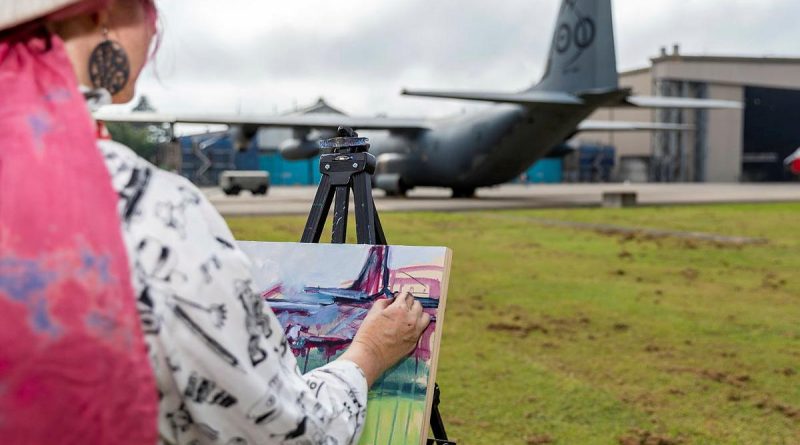 Mellissa Read-Devine, of the Ferry Artists Gallery, paints a RAAF C-130J on canvas with acrylic during the RAAF Base Richmond Artists’ Day. Photo by Corporal Dan Pinhorn.