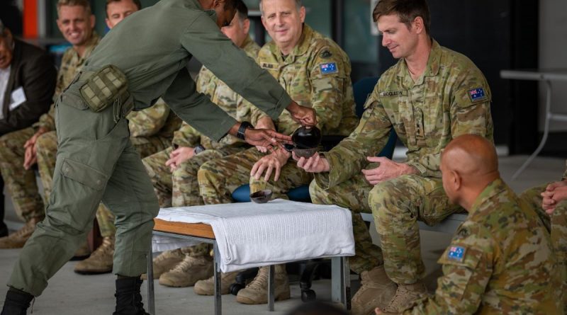 Private Sireli Levukaiciwa from the Republic of Fiji Military Forces gives Kava to the Commanding Officer of 8th/9th Battalion, the Royal Australian Regiment, Lieutenant Colonel John Eccleston. Photo by Private Jacob Hilton.