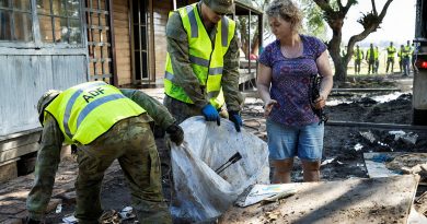 Soldiers remove debris from a flood-damaged property in Taree. Photo by Corporal Sagi Biderman .