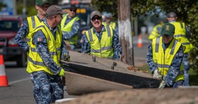 Air Force personnel remove flood-damaged items from local homes and streets in Port Macquarie during Operation NSW Flood Assist. Photo by Private Jacob Hilton.