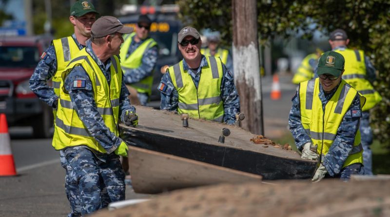 Air Force personnel remove flood-damaged items from local homes and streets in Port Macquarie during Operation NSW Flood Assist. Photo by Private Jacob Hilton.