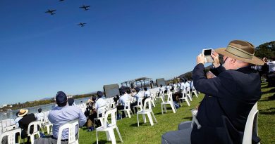 Royal Australian Air Force veteran Mr Alan Sullivan takes photos of Royal Australian Air Force aircraft flying over Rond Terrace, Canberra during the Air Force 2021 Centenary flyover. Photo by Cpl David Said.