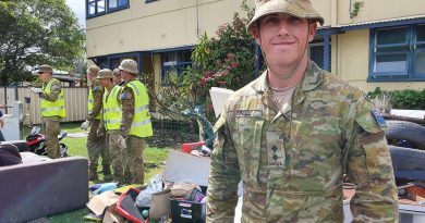 Lieutenant Kurt O’Neill, attached to the 2nd Combat Engineer Regiment, with his platoon help residents clean up after the flood at Laurieton.