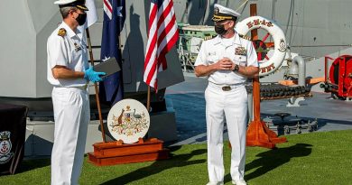 Commanding Officer HMAS Sydney Commander Ted Seymour, left, presents United States Navy officer Commander Robert Eilers with a Commander Australian Fleet Silver Commendation on board Sydney in San Diego. Story by Lieutenant Commander Scott MacPherson.