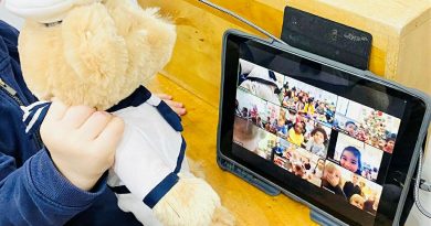 CAPTION: A Navy teddy is held by a child from the Vaucluse Cottage Childcare Centre in Sydney, during a Zoom call to sister preschools. Story by Lieutenant Kiz Welling-Burtenshaw. Photo by Emma Wholihan.