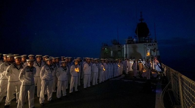 HMAS Anzac personnel conduct an Anzac Day ceremony in the South China Sea. Story by Lieutenant Geoff Long. Photo by Leading Seaman Thomas Sawtell.