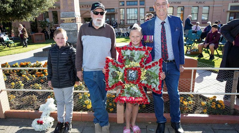 Relatives of Ordinary Seaman Edward “Teddy” Sheean, VC prepare to lay a wreath at an Anzac Day Service in Latrobe, Tasmania. From left, Mr Andrew Jarvie, Mr Ted Sheean, Miss Bella Sheean and Mr Garry Ivory. Story by Lieutenant Jessica Craig. Photo by Petty Officer Tom Gibson.