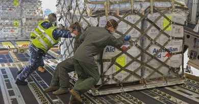 Royal Australian Air Force Air Movements Operators from No. 23 Squadron and No. 36 Squadron loadmasters, load a pallet of humanitarian aid on board a 36SQN C-17A Globemaster. Photo by Corporal Jesse Kane.