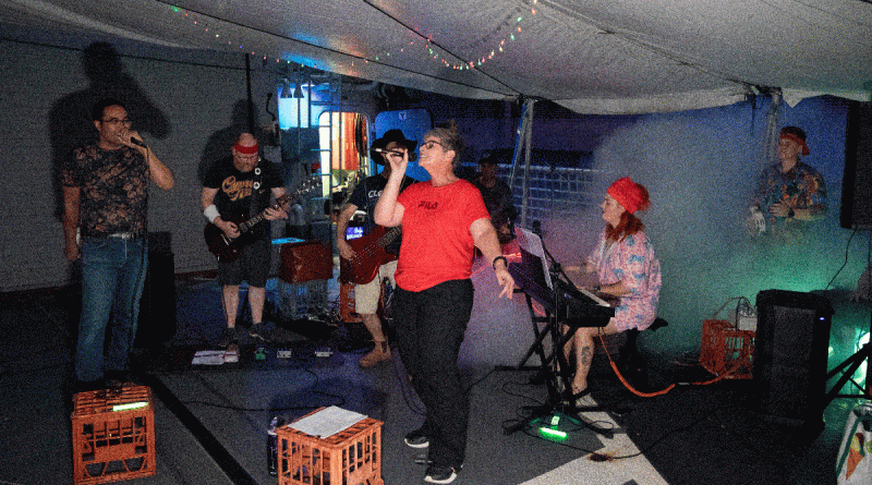 HMAS Anzac band, Hodr's Knorr, performs on the ship's flight deck during a logistics visit to in Sembawang, Singapore. Story by Lieutenant Geoff Long. Photo by Leading Seaman Thomas Sawtell.