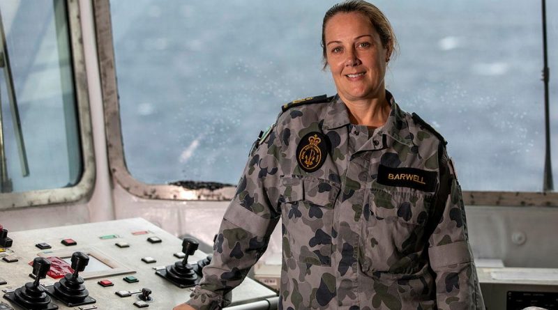 Petty Officer Hayley Barwell in the replenishment-at-sea control room on HMAS Sirius. Story by Lieutenant Geoff Long. Photo by Leading Seaman Thomas Sawtell.