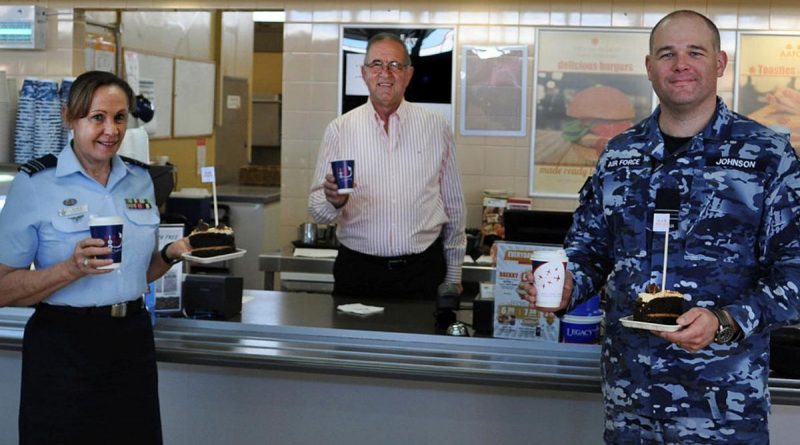 Veteran Paul Beraldo with Squadron Leaders Robyn Connell and Dane Johnson inside the Army and Air Force Canteen Service at RAAF Laverton.