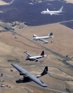 In an Australian first, a Catalina, Neptune, Orion and Poseidon fly together, representing four generations of aircraft flown by Number 11 Squadron based at RAAF Base Edinburg, South Australia. Photo by Corporal Craig Barrett.