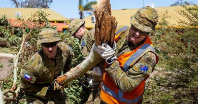 Privates Jordan Stidworthy, left, and Jarryd Kirby remove fallen branches and debris from Northampton District High School after Tropical Cyclone Seroja. Story by Captain Zoe Griffyn. Photo by Leading Seaman Kieren Whiteley.