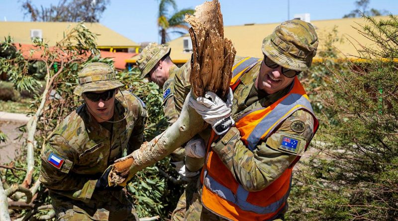 Privates Jordan Stidworthy, left, and Jarryd Kirby remove fallen branches and debris from Northampton District High School after Tropical Cyclone Seroja. Story by Captain Zoe Griffyn. Photo by Leading Seaman Kieren Whiteley.