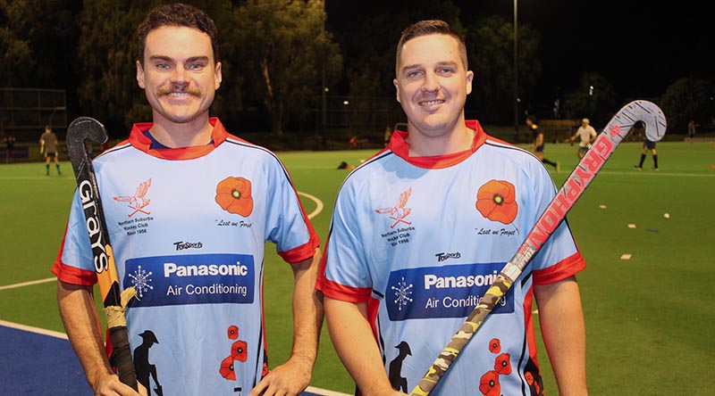 Norths Hockey Club players Jack Tucker and Australian Army Craftsman Peter Hamilton, of Gallipoli Barracks in Brisbane, wearing the special Diggers Appreciation Day jerseys.