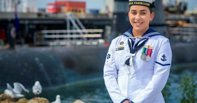 Leading Seaman Elizabeth McCallum in front of HMAS Collins at Fleet Base West in Rockingham, WA. Story by Lieutenant Rilana Ostheim. Photo by Leading Seaman Richard Cordell.