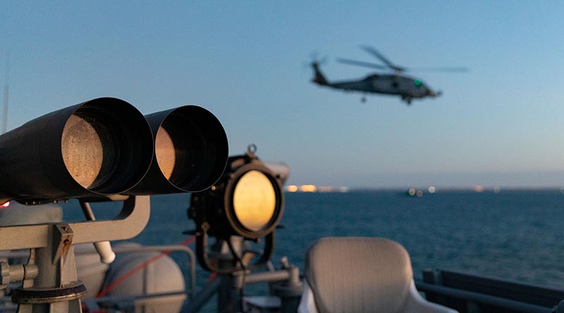 HMAS Ballarat's embarked MH-60R Seahawk departs the ship. Photo by Leading Seaman Shane Cameron.