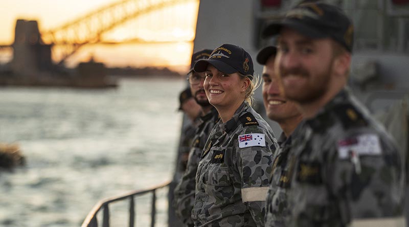 Able Seaman Claire Brown is all smiles as HMAS Parramatta departs Fleet Base East on Sydney Harbour for a two-month deployment to south-east and north-east Asia. Photo by Leading Seaman Jarrod Mulvihill.