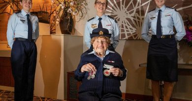 Leading Aircraftwoman Carley Dunn, left, Squadron Leader Del Gaudry, and Corporal Maddison Henry stand with Mrs Iris Terry during a formal presentation of a uniform at the Fairfield RSL. Story by Eamon Hamilton. Photo by Corporal Kylie Gibson.