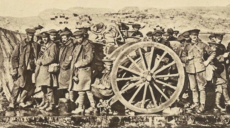 An evacuation raft built by the Royal Australian Navy Bridging Train is shown evacuating artillerymen with a field gun in January 1915. The rafts were towed by lighters during the evacuation from Gallipoli.