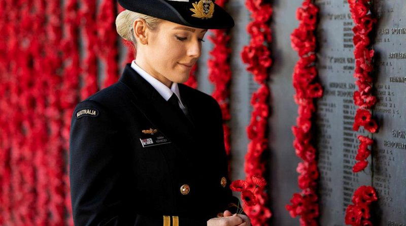Lieutenant Sarah Rohweder reflects in front of the Roll of Honour at the Australian War Memorial in Canberra. Story by Sergeant Sebastian Beurich. Photo by Leading Seaman Kayla Jackson.