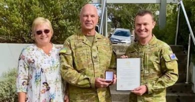 Sergeant Andrew Turner, accompanied by wife Susan, is presented with a Federation Star for 40 years service in the Australian Defence Force, by Commander Forces Command Major General Matt Pearse. Photo supplied by family.