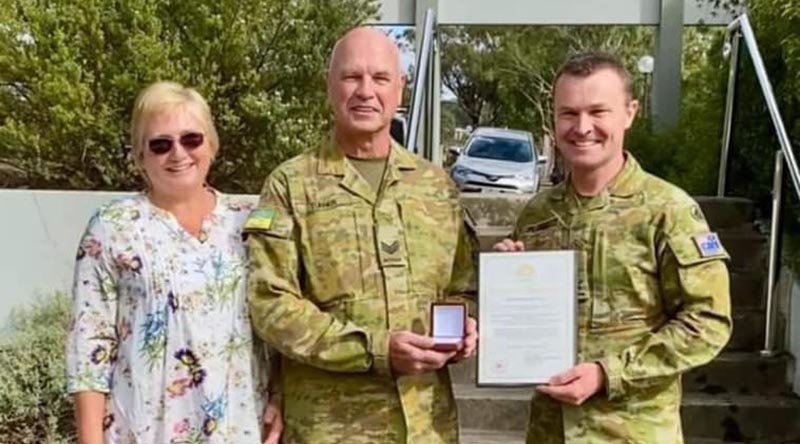 Sergeant Andrew Turner, accompanied by wife Susan, is presented with a Federation Star for 40 years service in the Australian Defence Force, by Commander Forces Command Major General Matt Pearse. Photo supplied by family.