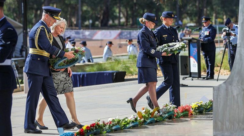 Chief of Air Force Air Marshal Mel Hupfeld, left, his wife Louise Hupfeld, Warrant Officer of the Air Force Fiona Grasby, and Leading Aircraftwoman Victoria Farell lay wreaths at the Air Force memorial. Photo by Leading Aircraftwoman Jacqueline Forrester.